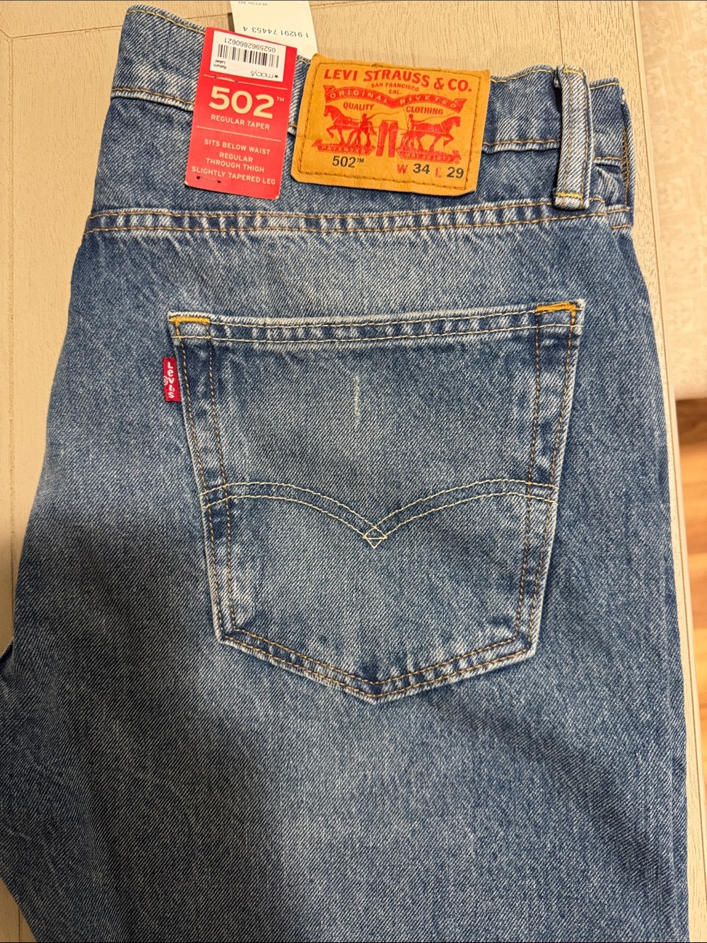 Levi's 502 Slim Straight Jeans in Light Blue Denim with Tan Patch